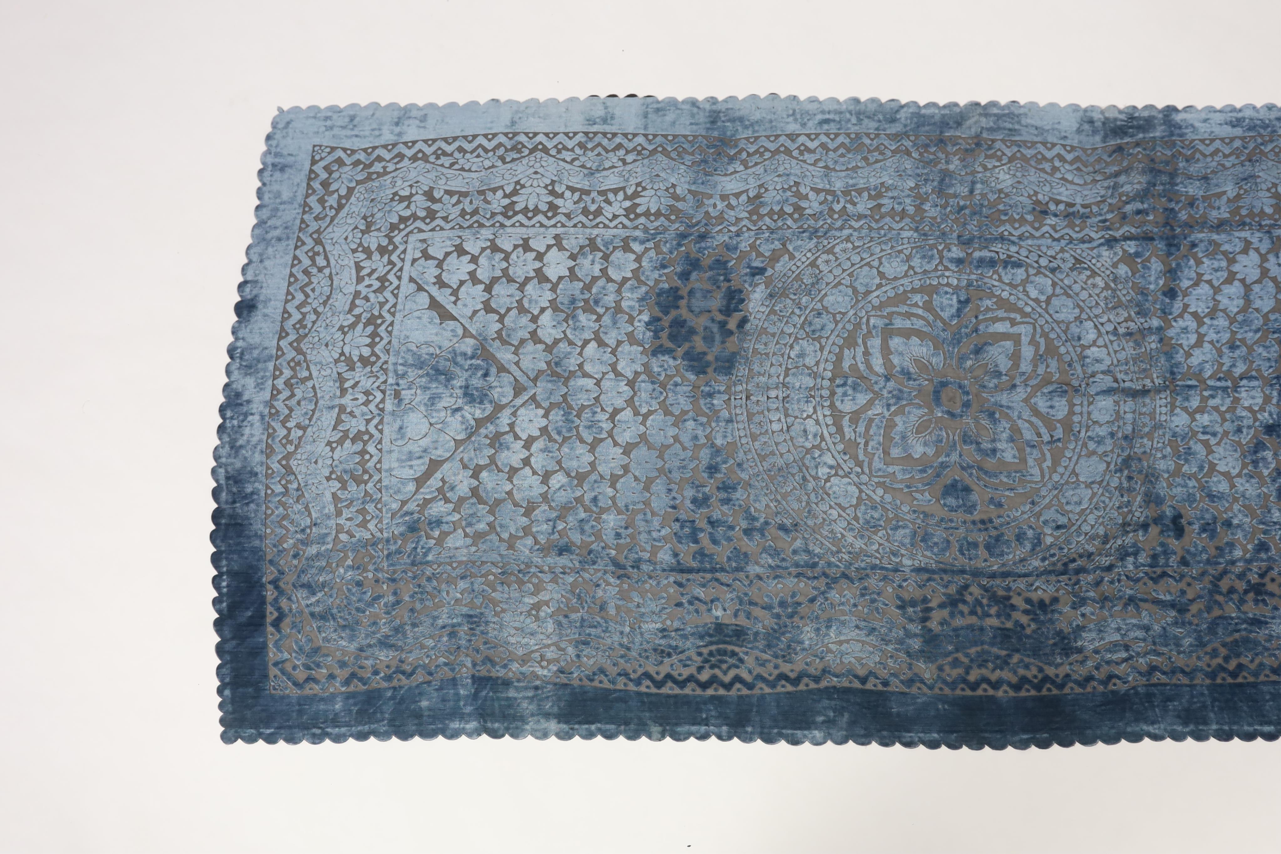 A 20th century blue and black patterned silk cut velvet evening stole with scalloped borders, 102cm wide x 224cm long